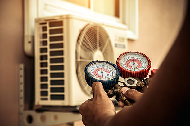 Professional Air Conditioning Service technician working in Grayson, KY